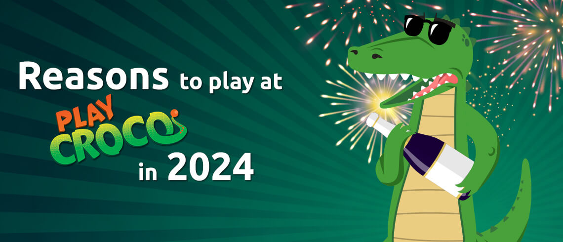 Croco with sunglasses holding a sparkler with fireworks in the background. Croco with sunglasses holding a sparkler with fireworks in the background.